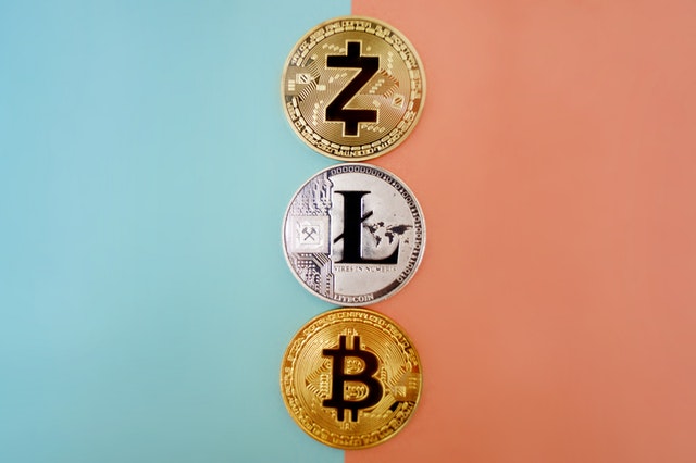 3 crypto coins representing the importance of cryptocurrency content translation