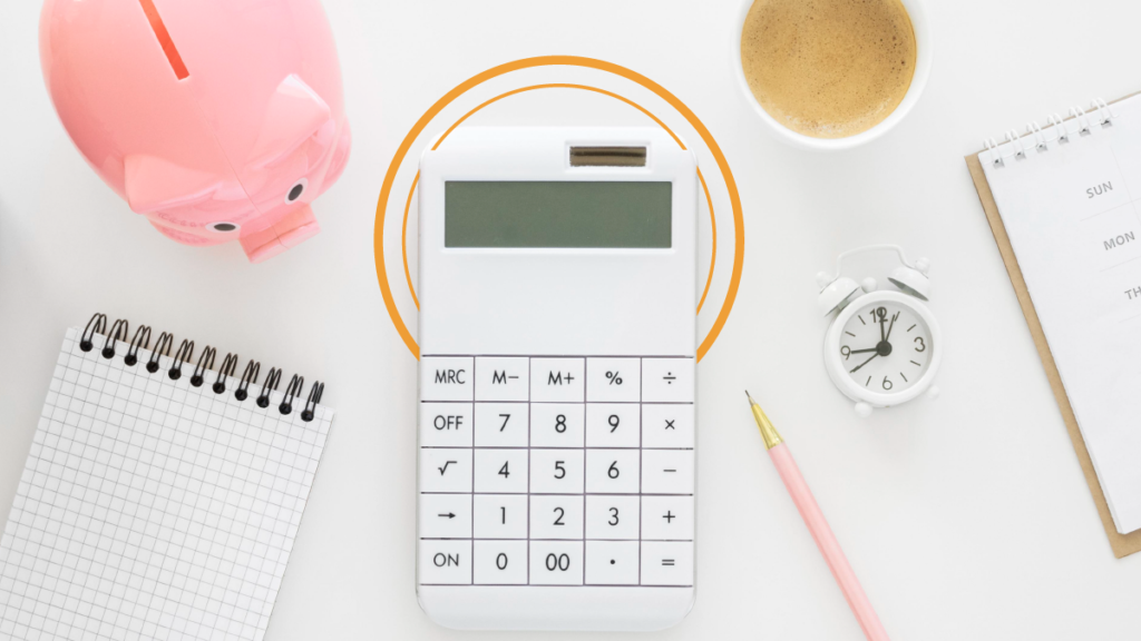 A table with a calculator and a piggy bank representing the costs of professional translation services 